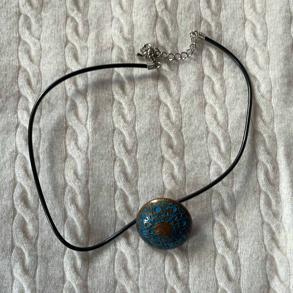 Cord necklace with turquoise and brass charm